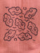 Decorative cloud pattern on a textured pink fabric background