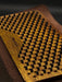 Wooden brush with black bristles on a dark background