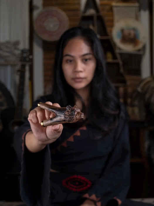Woman holding a bone in a workshop setting