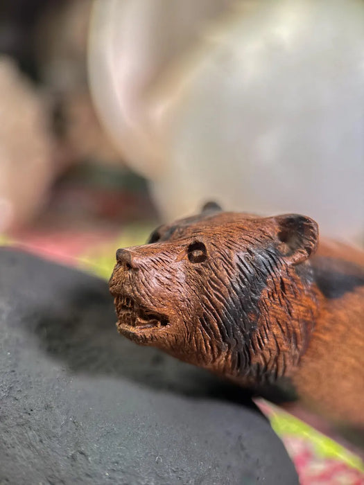Close-up of a bear figurine with a blurred background