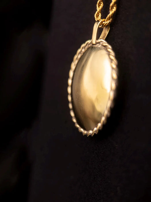 Gold locket on a dark background