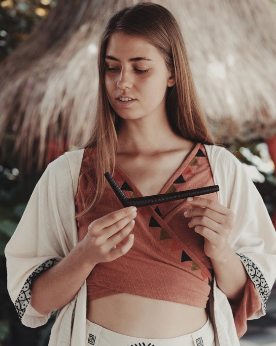 This handcrafted rose wood Tepi Kuripe from Bali is a portable tool for Hape, designed for shamanic practices and spiritual meditation.
