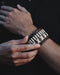 Bold, handcrafted buffalo leather bracelet with ethnic design, embodying raw strength and spiritual symbolism.