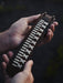 Bold, handcrafted buffalo leather bracelet, symbolizing raw energy and deep ancestral roots for the modern man.