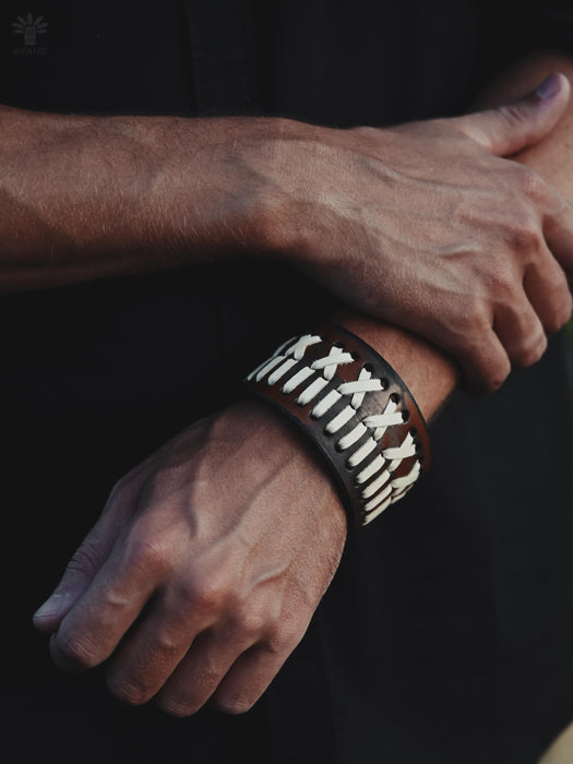 Handmade buffalo leather cuff with wide, bold design, symbolizing strength, spirituality, and ancestral connection.