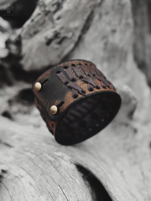 Handcrafted buffalo leather bracelet with earthy rust-brown tone and triple-infinity symbol — perfect for meditation or everyday wear.