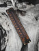 Handcrafted rust-brown buffalo leather bracelet featuring a triple-loop infinity symbol, representing the connection between body, spirit, and nature.